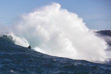 Davy Wooffindin on a set wave  during a session at a remote reefbreak near Dunedin, New Zealand.