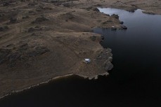 Huts on the Poolburn Reservior, Central Otago, New Zealand. Photo: Derek Morrison