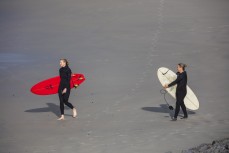 Surf coaches Claire Hepperlin and Tash Civil at Blackhead, Dunedin, New Zealand.