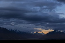Girl silhouetted by dramatic skies near Lake Tekapo, Canterbury, New Zealand.Credit: www.boxoflight.com/Derek Morrison