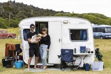 Jamie, Courtney and baby Lenni camping at a remote beachbreak in the Catlins, New Zealand. Photo: Derek Morrison