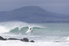 A surfer drops into a solid wave during a clean summer swell at Aramoana, Dunedin, New Zealand.
Credit: www.boxoflight.com/Derek Morrison