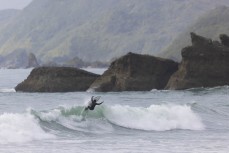 Jack Mckenzie surfing at at Fox River, West Coast, New Zealand.