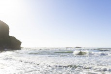 Campbell Heasley river surfing on high tide at Fox River, West Coast, New Zealand.