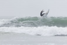 Tai Mckenzie surfing at at Fox River, West Coast, New Zealand.