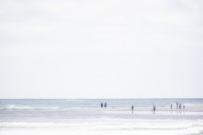 Beachgoers at Whangamata, Coromandel, New Zealand.