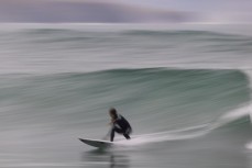 Paul Moretti makes the most of fun waves on the North Coast, Dunedin, New Zealand.