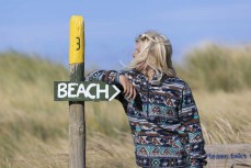 Keo on the hunt for waves at a remote North Coast beach, New Zealand.