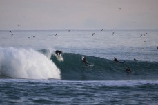 Keo Morrison drops into a wave at Blackhead, Dunedin, New Zealand.
Photo: Derek Morrison