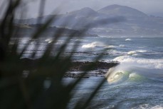 Sneaky runner during a fun swell at a break along the South Coast, Dunedin, New Zealand.Photo: Derek Morrison