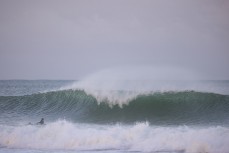 Taya and Rewa Morrison wear a set on the head during a fun swell at a break along the South Coast, Dunedin, New Zealand.Photo: Derek Morrison