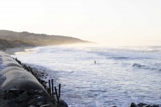 Dawn and the last straw (pole) at St Clair, Dunedin, New Zealand.
Photo: Derek Morrison