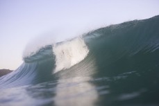 Keo Morrison going over the falls on a wave at Blackhead, Dunedin, New Zealand.Credit: Derek Morrison
