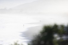 Beach walkers at Blackhead, Dunedin, New Zealand.Credit: Derek Morrison