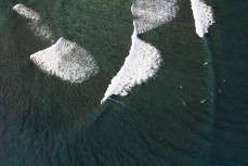 Telescopes during a September swell in the Mentawais Island chain, Western Sumatra, Indonesia.