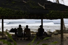 The lads take a breather during a September swell at Thunders in the Mentawais Island chain, Western Sumatra, Indonesia.