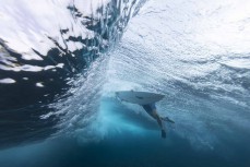 Bailing out during a September swell at Thunders  in the Mentawais Island chain, Western Sumatra, Indonesia.