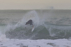 Ricardo Christie gets one before work at a beachbreak near Gisborne, Eastland, New Zealand.