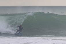 Ricardo Christie gets one before work at a beachbreak near Gisborne, Eastland, New Zealand.