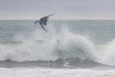 Ricardo Christie gets one before work at a beachbreak near Gisborne, Eastland, New Zealand.