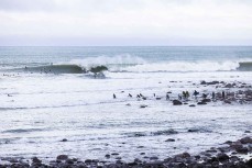 The lineup at dawn ahead of the 2022 New Zealand Scholastics Surfing Champioships held at a pointbreak near New Plymouth, Taranaki, New Zealand.