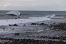 Free surfing at a pointbreak near New Plymouth, Taranaki, New Zealand.