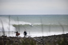 Cargs and Dave Entwisle head for a free surf during the 2022 New Zealand Scholastics Surfing Champioships held at a pointbreak near New Plymouth, Taranaki, New Zealand.