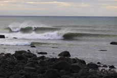 Free surfing at a pointbreak near New Plymouth, Taranaki, New Zealand.