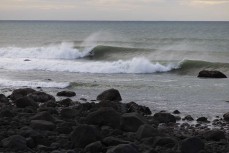 A local gets a standup tube at a pointbreak near New Plymouth, Taranaki, New Zealand.