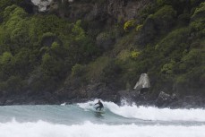 Rewa Morrison rides a wave at Whareakeake, Dunedin, New Zealand.