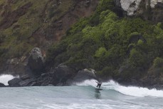 Keo Morrison rides a wave at Whareakeake, Dunedin, New Zealand.