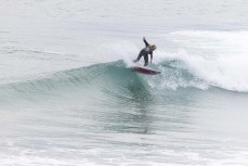 Keo Morrison surfs at Blackhead, Dunedin, New Zealand.