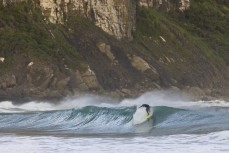 Theo Wallis drops in during a playful swell in the Catlins, Southland, New Zealand.Credit: Derek Morrison