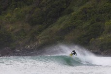 A surfer makes the most of a northeast swell at a remote pointbreak near Dunedin, New Zealand.Credit: Derek Morrison