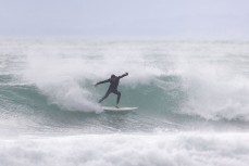 A surfer during a northeast swell at a remote pointbreak near Dunedin, New Zealand.
Credit: Derek Morrison
