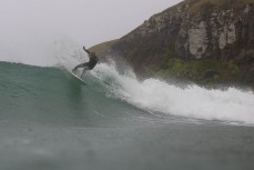Jeff Patton during a northeast swell at a remote pointbreak near Dunedin, New Zealand.Credit: Derek Morrison