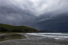 Weather during a northeast swell at a remote pointbreak near Dunedin, New Zealand.
Credit: Derek Morrison