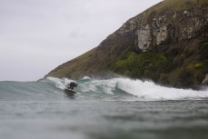 Keo Morrison during a northeast swell at a remote pointbreak near Dunedin, New Zealand.Credit: Derek Morrison