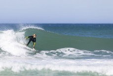 Felix Gibbs on a runner during a small summer swell at Blackhead, Dunedin, New Zealand.
Credit: Derek Morrison