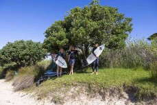 Rewa, Keo and Ken prepare for a fun swell near Ahipara, Northland, New Zealand.