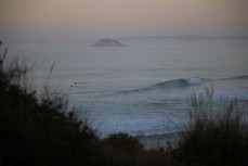 Dawn reveals a fun summer swell at Blackhead, Dunedin, New Zealand.