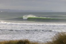 A quality lineup during a swell produced by Cyclone Gabrielle on the north coast of Dunedin, New Zealand.