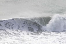 Frothy wave during a swell produced by Cyclone Gabrielle on the north coast of Dunedin, New Zealand.