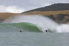 Jeff Patton on a set wave during a swell produced by Cyclone Gabrielle on the north coast of Dunedin, New Zealand.