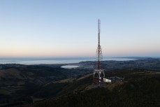 Dunedin and the aerial atop Mt Cargill at dawn, Dunedin, New Zealand.