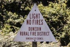 Fire sign at Wickliffe Bay, Dunedin, New Zealand.Credit: Derek Morrison