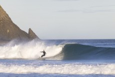 A surfer makes the most of a fun swell at Blackhead, Dunedin, New Zealand.