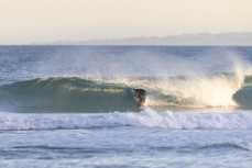 Jack McLeod gets barreled at Blackhead, Dunedin, New Zealand.