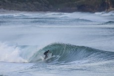 Luke Murphy gets barrelled during a clean autumn swell at St Clair, Dunedin, New Zealand.