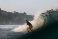 Taya Morrison lines up a barrel at Uluwatu, Bali, Indonesia.